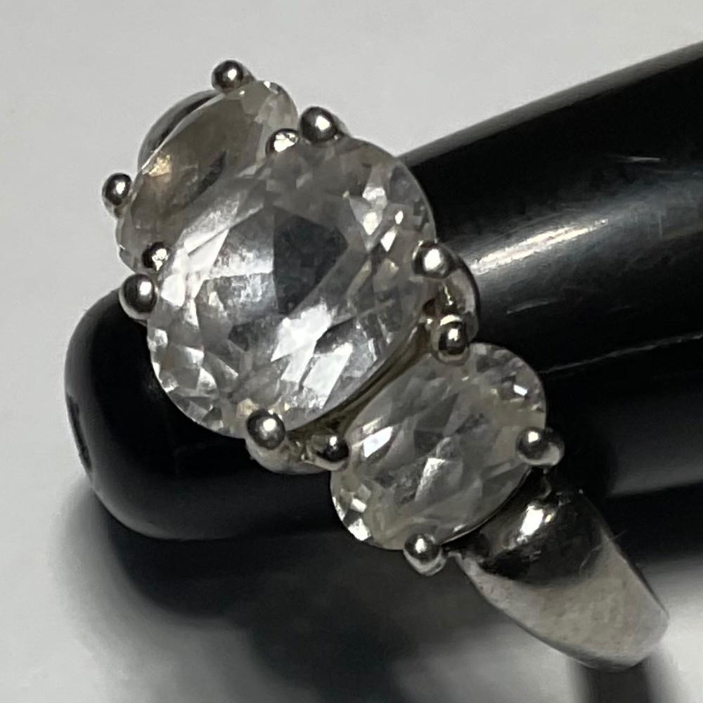 Sterling silver ring with three clear stones. Size 5.